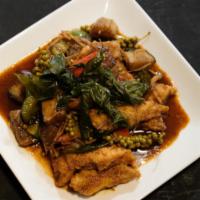 42. Catfish Delight · Deep Fried sliced fresh catfish stir fried with red curry paste, bell pepper, eggplant, basi...