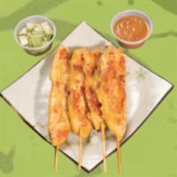 Chicken Satay · Six sticks served with peanut sauce and cucumber salad.