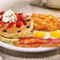 Double Berry Pancake Breakfast · Buttermilk pancakes cooked with blueberries and topped with fresh seasonal berries and whipp...