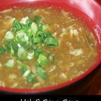 Hot and Sour Soup · Szechuan style shredded pork, tofu, fresh mushrooms and bamboo shoots in a spicy egg drop so...