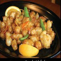 2. Orange Peel Chicken · Breaded chicken with carrots in a tangy orange sauce.