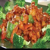 6. General Tso's Chicken · Szechuan style breaded chicken with green and red pepper, onion, surrounded by steamed brocc...