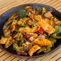 11. Hunan Chicken · Hunan style chicken with broccoli, celery, green and red peppers and onion in a spicy hunan ...
