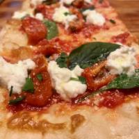 Holiday Pizza · Baby spinach, roasted tomatoes, ricotta, mozzarella & fresh basil.