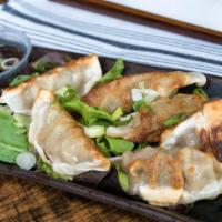 Dumplings · Pan seared, Asian sauce.