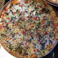 11. Veggie Muncheeze Pizza · Mushroom, artichoke hearts, onions, tomato, garlic and spinach. Vegetarian.