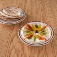 Hummus · Healthy dip made from blend of chick peas, tahini, lemon juice and garlic. Prepared with ext...