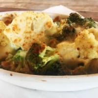 Baked Cauliflower · Cauliflower and broccoli baked in a garlic-lemon sauce and topped with Parmesan.