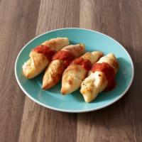 4 Pizza Rolls · Filled with pepperoni and mozzarella. Served with sauce.