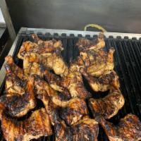 1/4 Classic Jerk Chicken · Chicken seasoned and marinated in Ocean Blue spicy jerk
marinate then grilled to perfection.