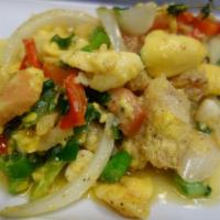 Ackee and Saltfish · Jamamica's national dish salted cod and ackee saute with fresh veggies, herbs and spices rec...