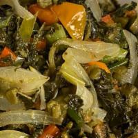 Callaloo · Green leafy vegetables cooked to perfection with onions,
tomatoes, garlic, herbs and spices.