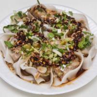 13. Wontons with Spicy Sauce · Hot and spicy. Has pork, shrimp and vegetables