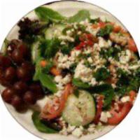 Greek Salad · Feta, olives, cucumbers, tomatoes, sauteed onion and peppers.