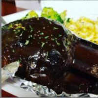 Beef BBQ Ribs · Beef BBQ ribs slow roasted to tenderness and perfection served with a choice of 2 sides