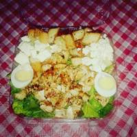 Grilled Chicken Caesar Salad · Includes a toasted roll with butter.