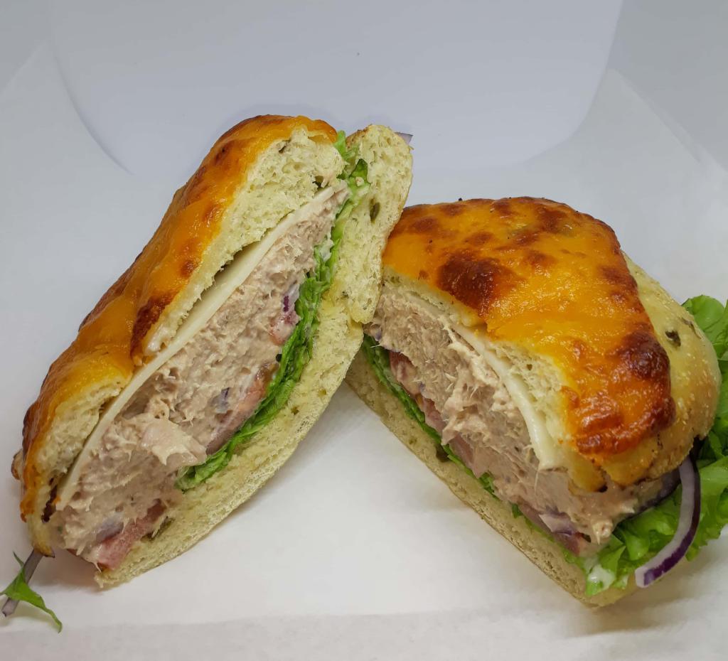Tuna Salad Sandwich · Tuna salad made with lemon pepper, Greek oregano, mayo and pinch of salt in-house with lettuce, tomato, and cucumbers on a choice of bagel.