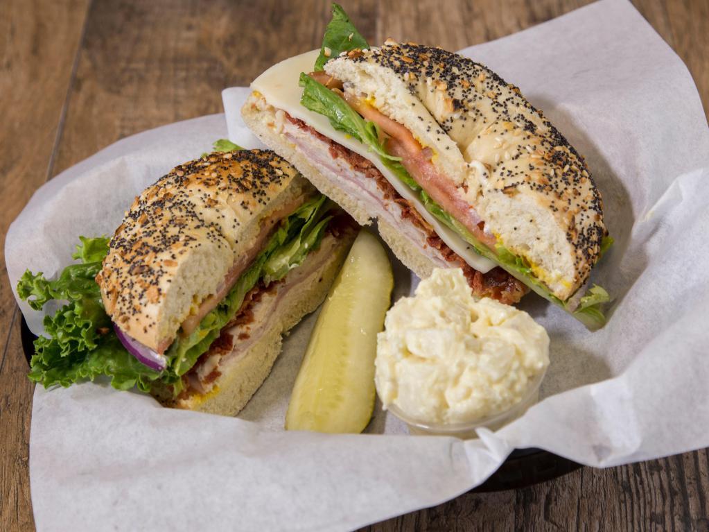 Gold Canyon Club Sandwich · Ham, turkey, bacon, lettuce, tomatoes, red onions, mayo, and mustard with a choice of cheese and bagel.
