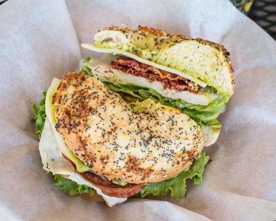 Turkey Avocado Club Sandwich · Turkey, bacon, and provolone cheese with avocado, lettuce and tomatoes on a choice of bagel.