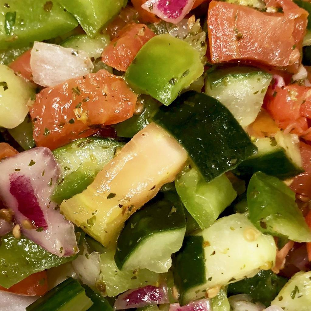 House Salad · Chopped tomato, cucumber, pepper, onion, herbs, lemon and olive oil.