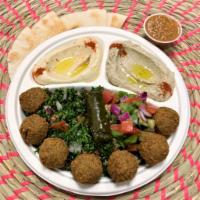 Vegetarian Mezza · Falafel, grape leaves, salad, tabbouleh and hummus eggplant dip. Served with pita. Vegetarian.