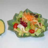24. House Salad · Mixed salad with romaine heart and tomatoes. Served with choice of dressing.