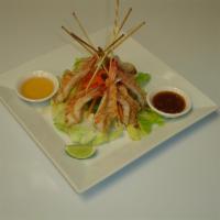 68. Grilled Shrimp · Grilled jumbo shrimp served with mixed green salad, plum sauce and chili lemon sauce.