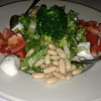 Insalata di Vegetali · Chopped salad with baby mix greens, broccoli, marinated tomatoes, white beans, soft mozzarel...