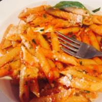 Penne Arrabbiata · In a spicy tomato and garlic sauce. Vegetarian.