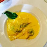 Ravioli Zafferano  · Homemade ravioli filled with ricotta and spinach in a creamy saffron sage sauce. Vegetarian.
