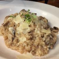 Risotto Norcina · Served with shiitake, portobello, oyster mushrooms and chicken sausage.