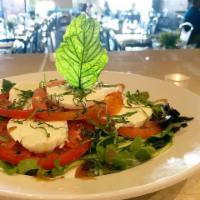 Caprese Salad · Sliced tomato, fresh Mozzarella, fresh basil leaves, prosciutto, arugula and black olives. S...