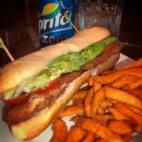 Milanesa Sandwich · Breaded steak or chicken with lettuce, tomatoes and mayo.
