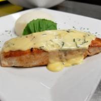 Grilled Salmon · Salmon fillet cooked to perfection, topped with a creamy herbs sauce.