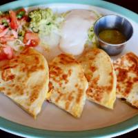 Chicken Quesadilla · Two flour tortillas filled with chicken and cheese, grilled until golden brown. Served with ...
