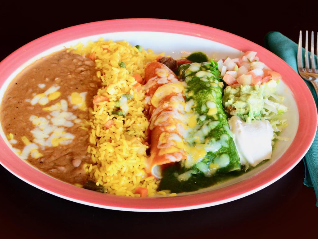4. Beef and Chicken Enchilada · 2 enchiladas. beef and chicken mixed. Served with rice, refried beans, lettuce, pico de gallo, guacamole and sour cream.