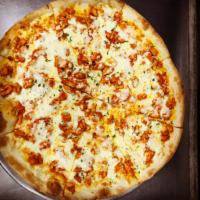 Buffalo Chicken Pizza · Crispy round pie topped with Louisiana style spicy chicken pieces and mozzarella.