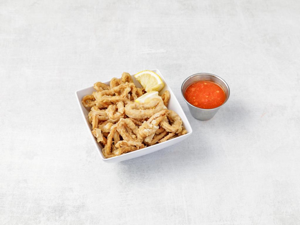 Calamari Fritti · Tender calamari floured then light fried and served with warm marinara sauce and a wedge of fresh lemon.