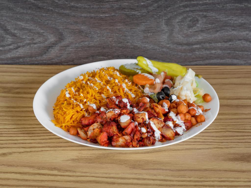 Chicken Gyro Platter · Tandoori-style chicken gyro pieces served over juicy, flavorful rice. Completed with your choice of mixed salad toppings and our signature white sauce, green sauce and hot sauce. Complete your meal for an additional charge. 

