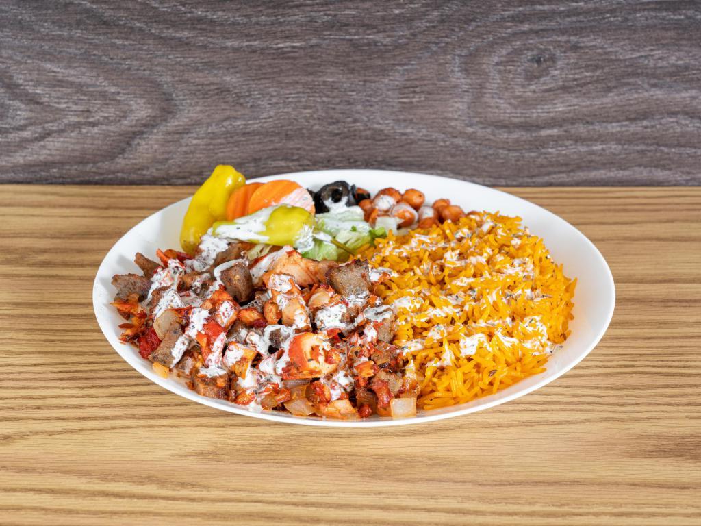 Mixed Gyro Platter · A combination platter consisting of chicken and lamb meat served over rice and salad. This platter is completed with your choice of mixed salad toppings and our signature white sauce, green sauce and hot sauce. Complete you meal for an additional charge.