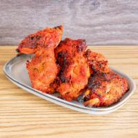Tandoori Wings · Spicy chicken wings cooked in a tandoor oven. Complete your meal for an additional charge. 


