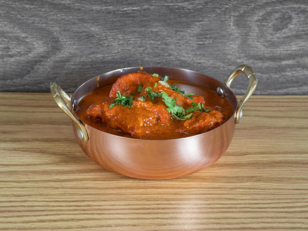 Chicken Tikka Masala Curry · Boneless pieces of chicken swimming in a creamy, tomato curry sauce. Add sides for an additional charge. Toppings and sauces available. Complete your meal for an additional charge. 