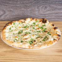 Garlic Naan · Naan bread handsomely dressed with chopped garlic and cilantro topped with a brush of melted...