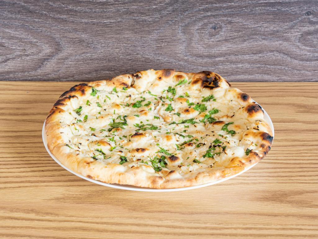 Garlic Naan · Naan bread handsomely dressed with chopped garlic and cilantro topped with a brush of melted butter.

