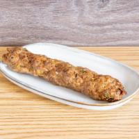 Lamb Kebab · Ground lamb meat is carefully marinated and prepared on a skewer in the same manner as chick...