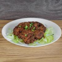 Chapli Kebab · The chapli kebab-aka flat kebab is made of ground chicken meat, a combination of herbs and s...