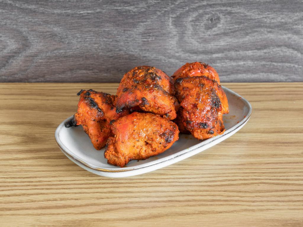 Chicken Tikka · 6 pieces of chicken tikka handsomely marinated in a unique mixture and cooked in our tandoor oven.