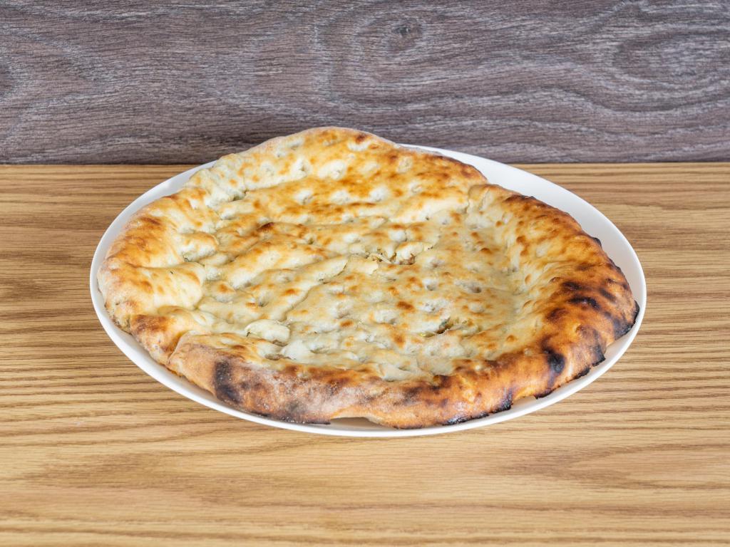 Keema Naan - Lamb · Ground lamb keema enclosed in a naan bread, baked in a tandoor oven. Couples well with mint sauce.

