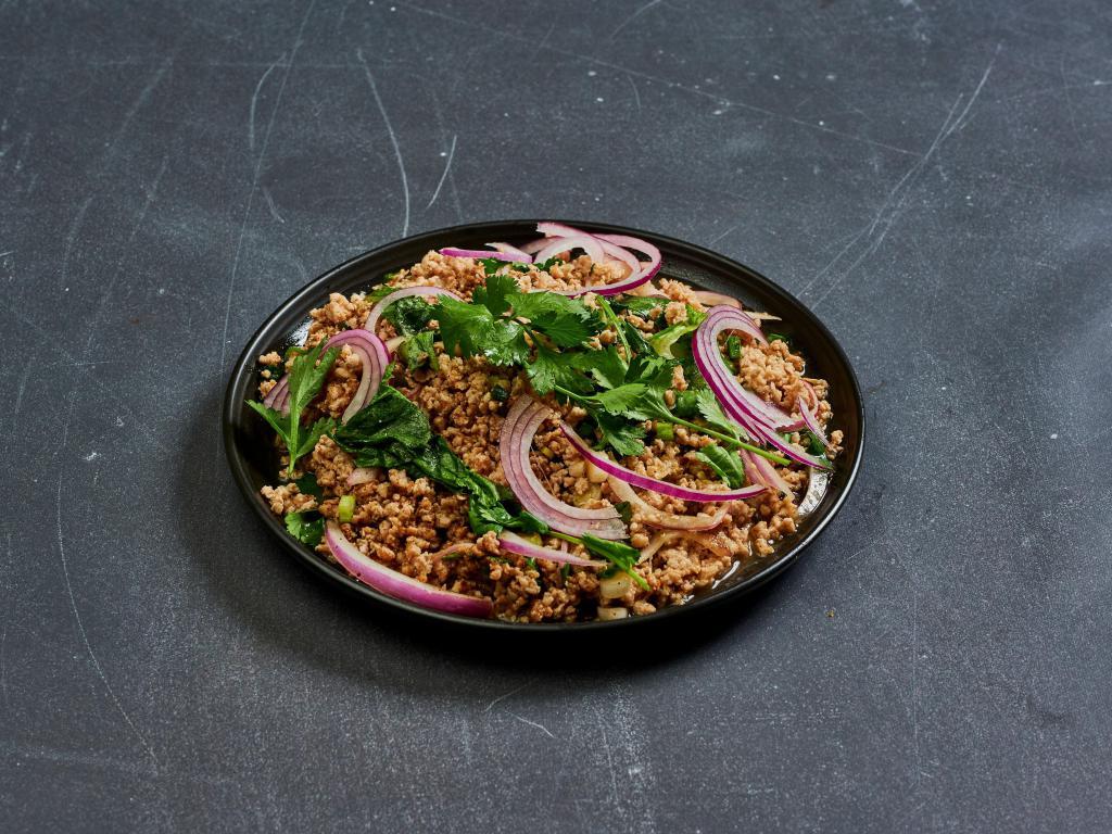 30. Larb Chicken Salad · Ground chicken with chili, red onions, green onions, cilantro, ground toasted rice and lime juice served with romaine lettuce. Spicy.