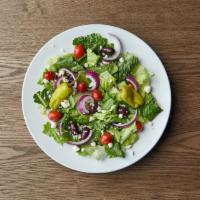 Greek Salad · Romaine and iceberg mix with tomatoes, onions, feta cheese, pepperoncini peppers and Greek o...